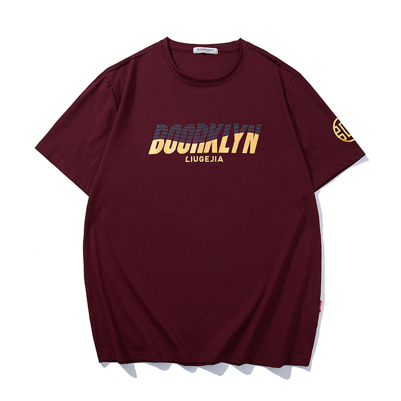 LIUGEJIA Gold Foil Hot-Stamp Tee - Date Red, jumbled wordmark + LIUGEJIA gold cursive + sleeve emblem